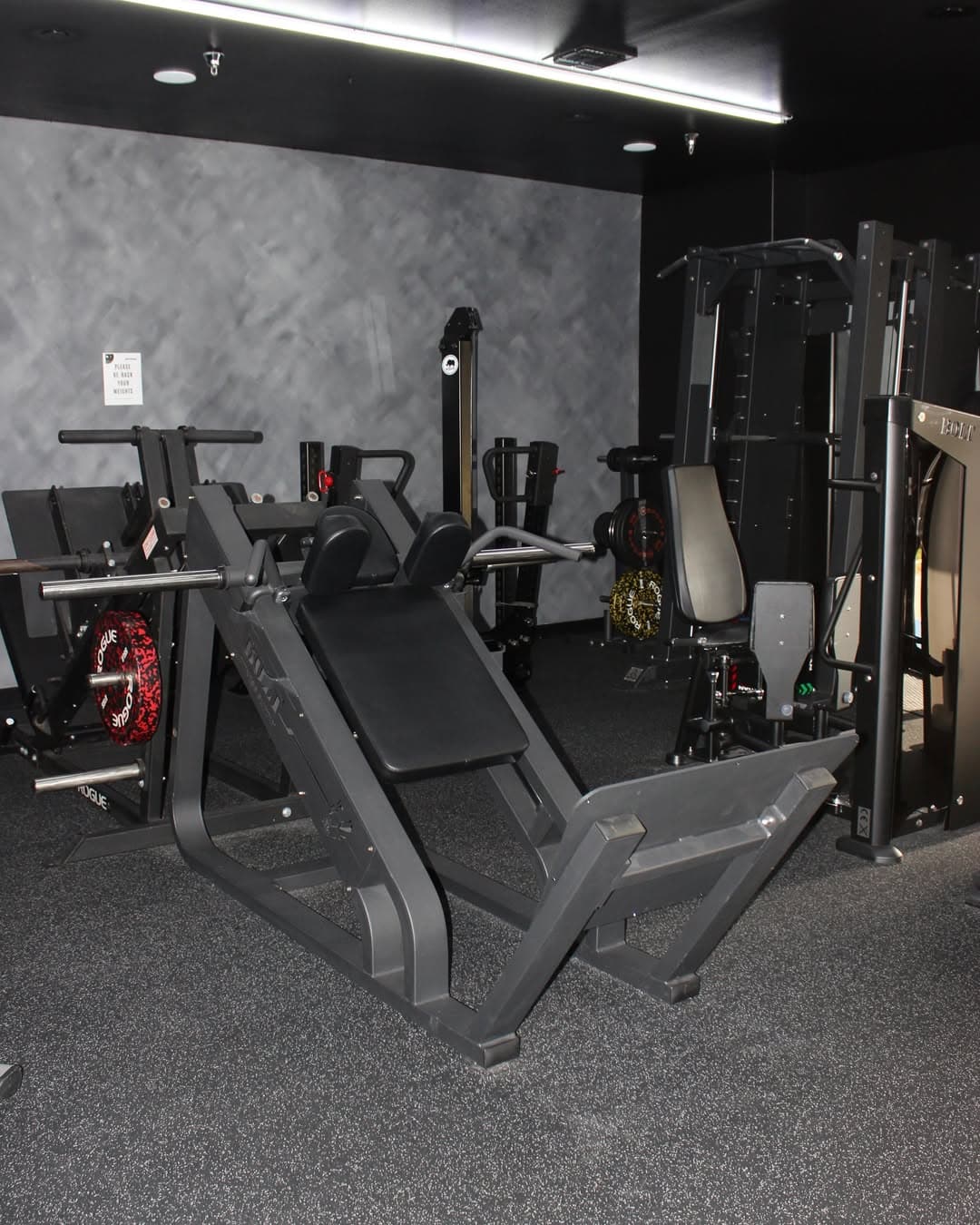 Plate loaded strength machines in the dark machine room