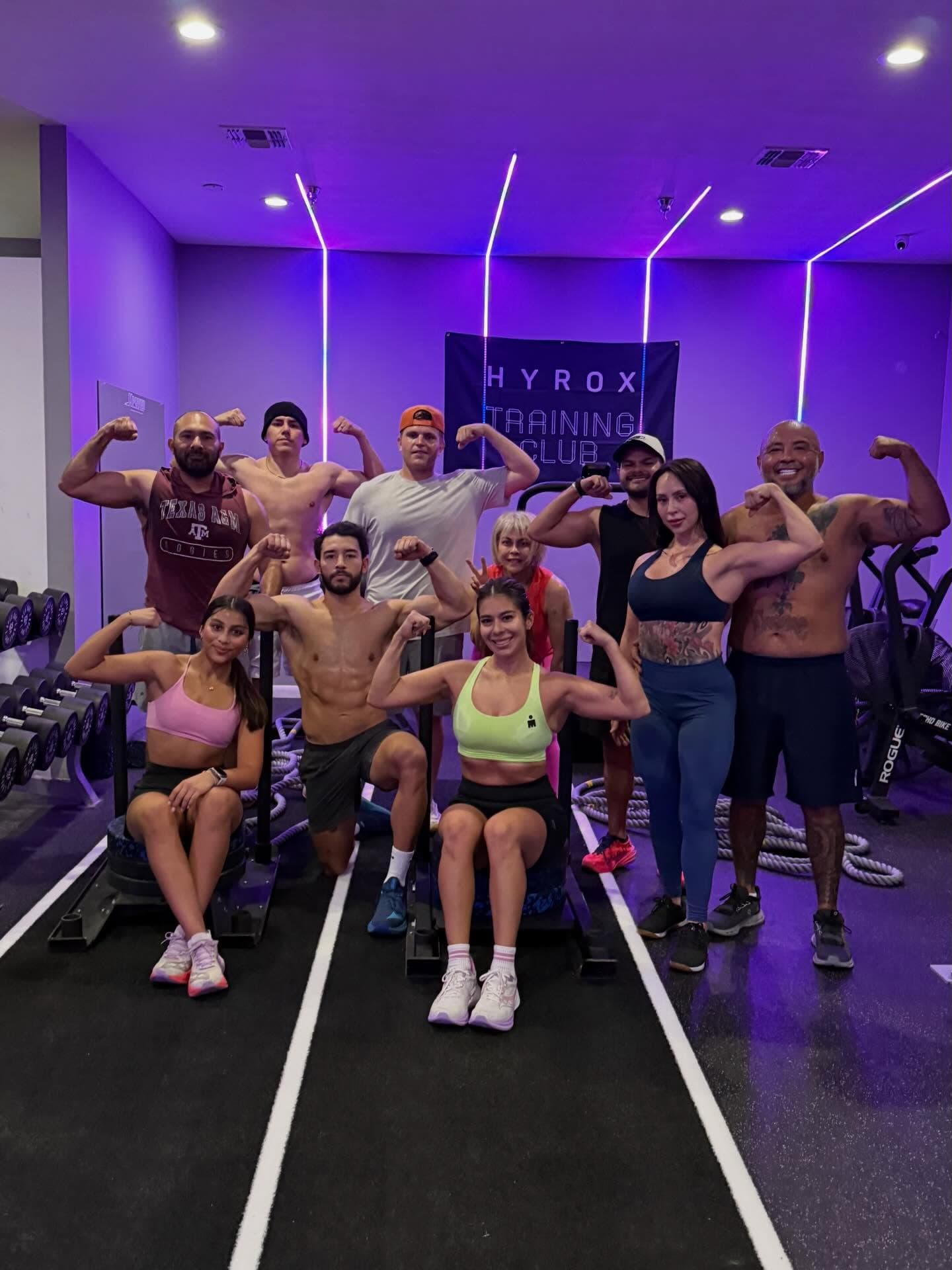 Members gathered on the training floor after a session