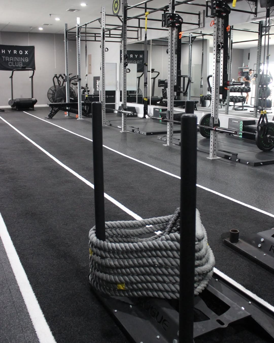 Racked plates and machines on the training floor